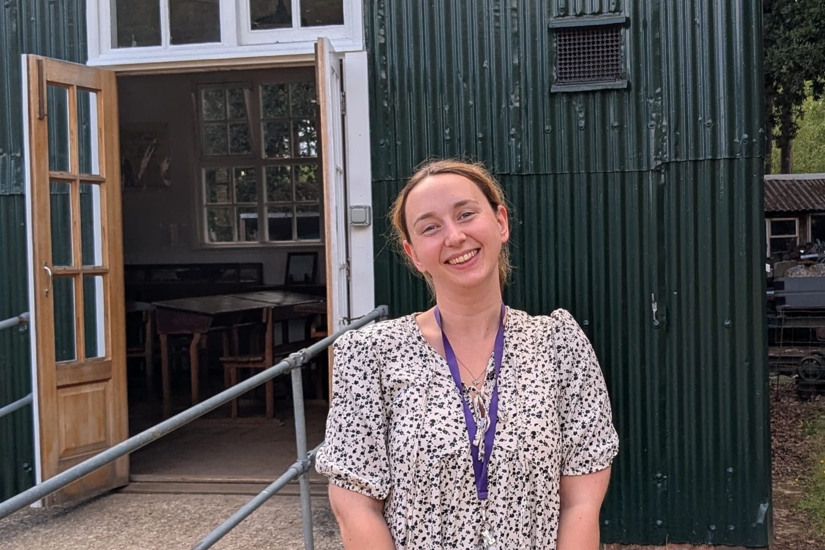 Alex in front of the school house.