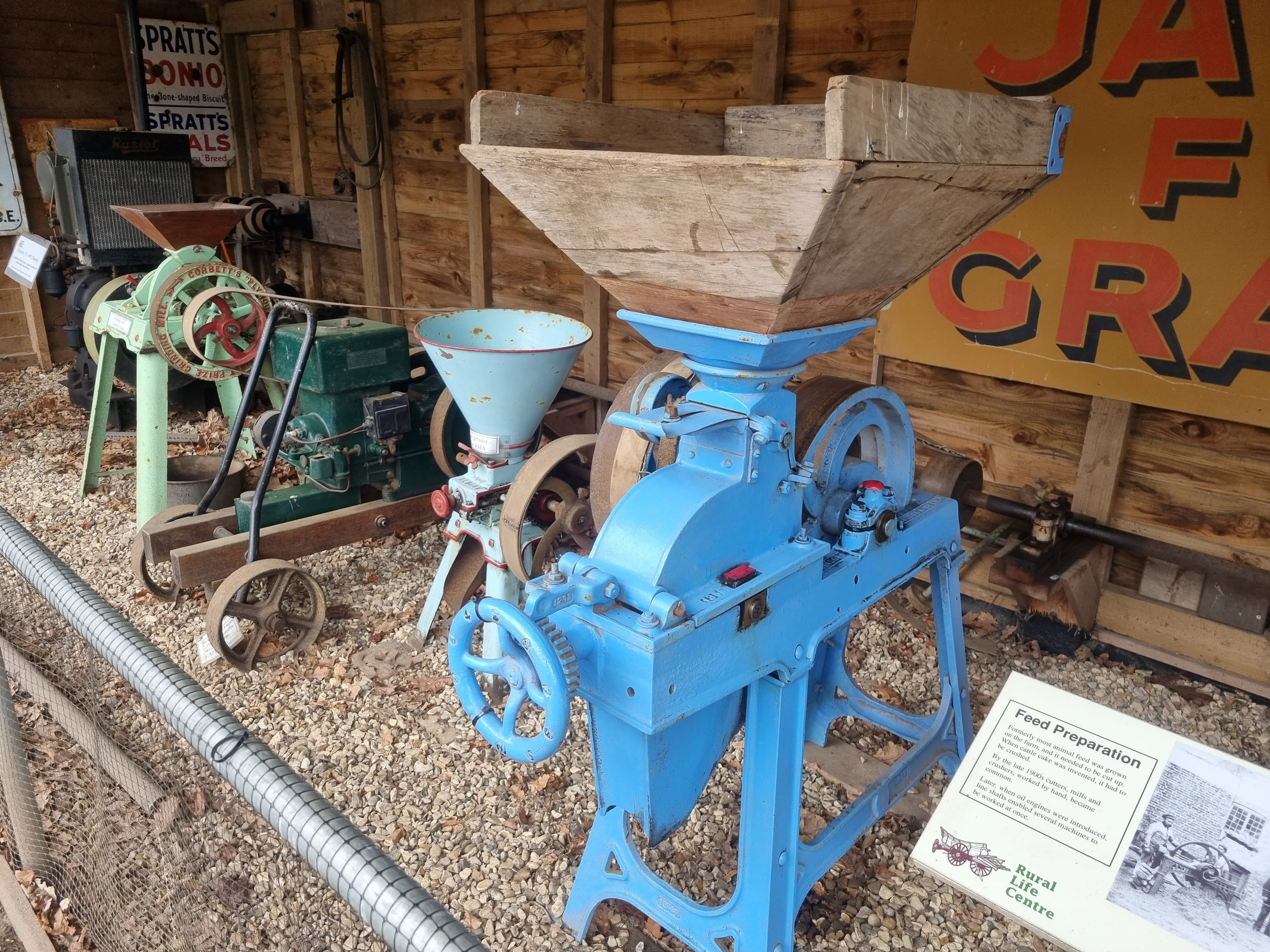 A photo of seed feeders amongst some other artifacts at the Rural Life Living Museum.